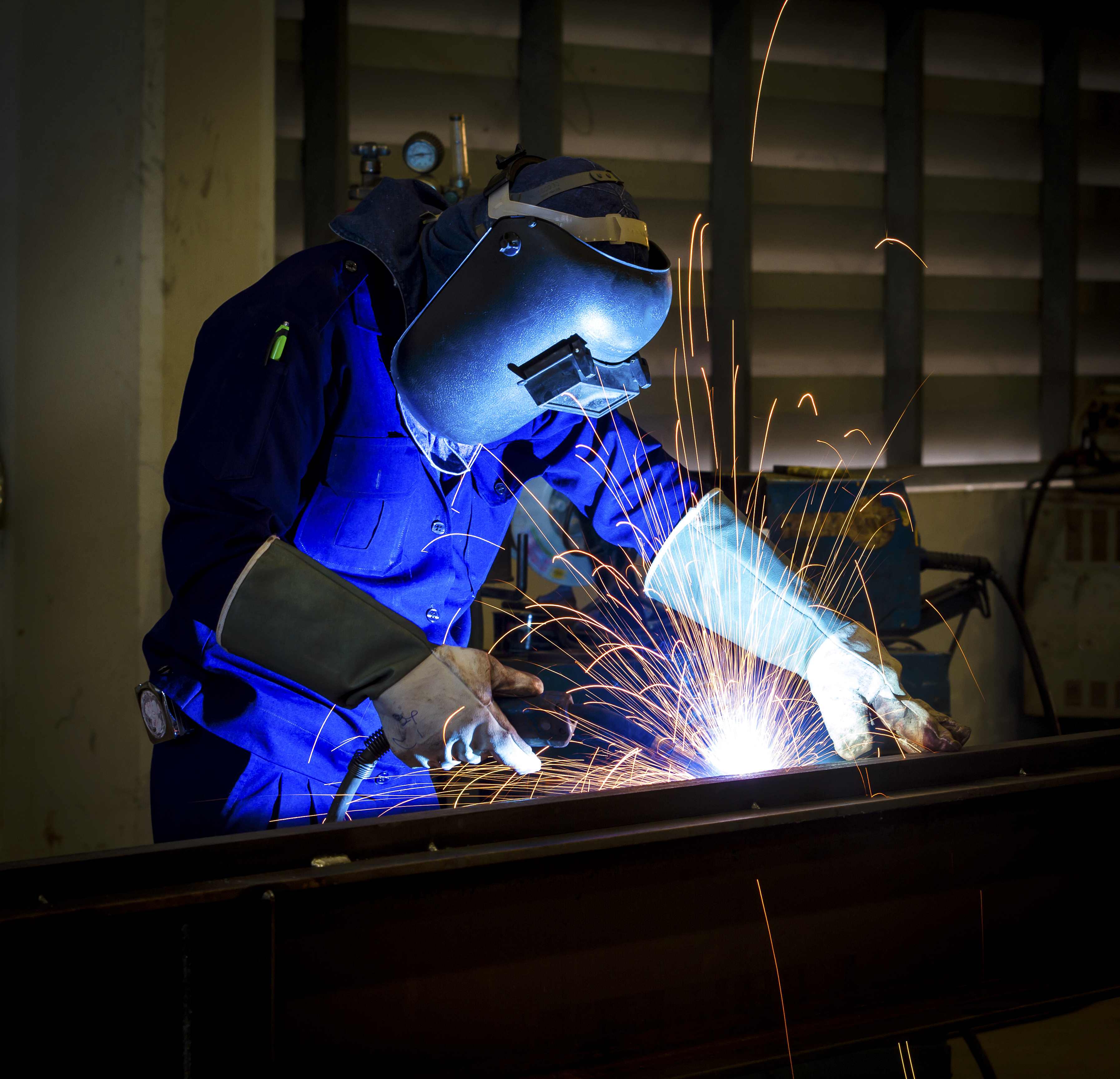 A welder wearing a mask