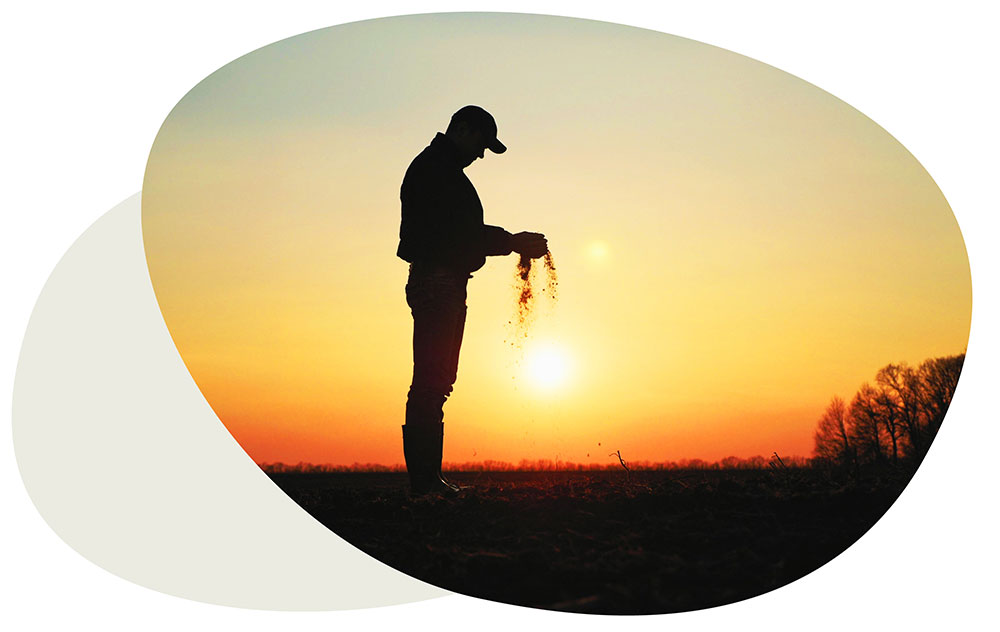 Image of man holding sand through his fingers